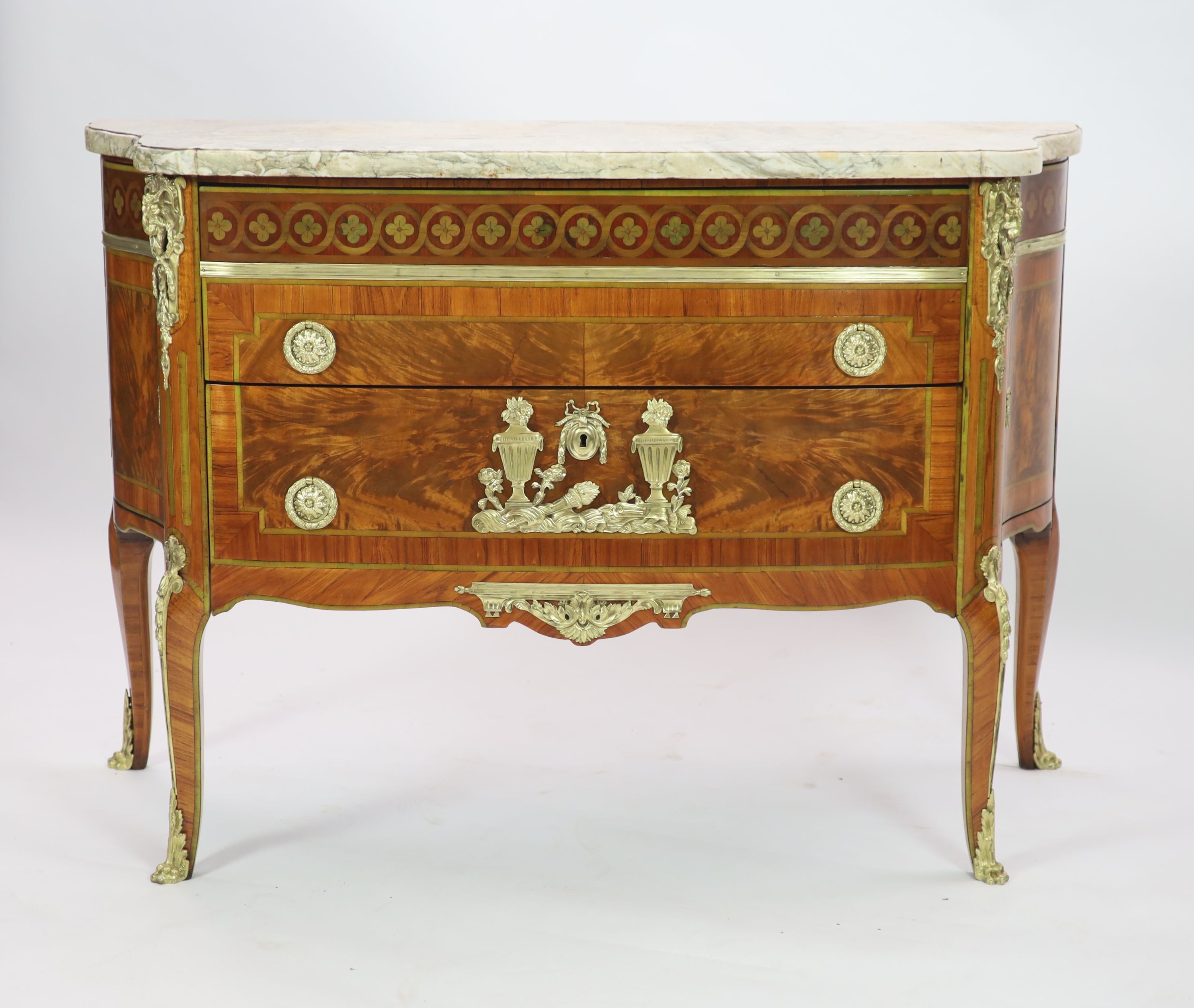 A late 19th century French marquetry and flame mahogany bowfront commode W.131cm D.54cm H.90cm
